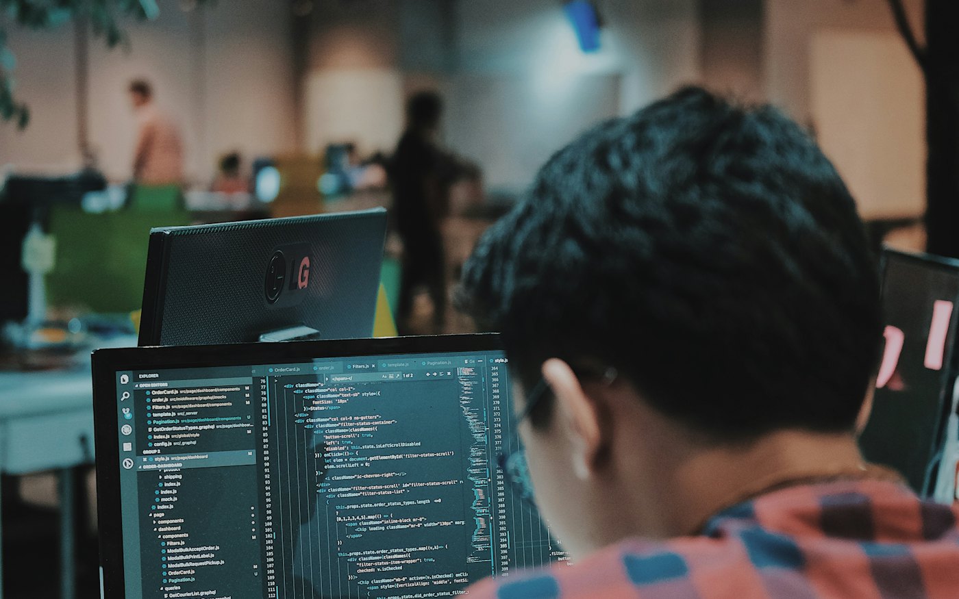 Engineer coding in a modern workspace